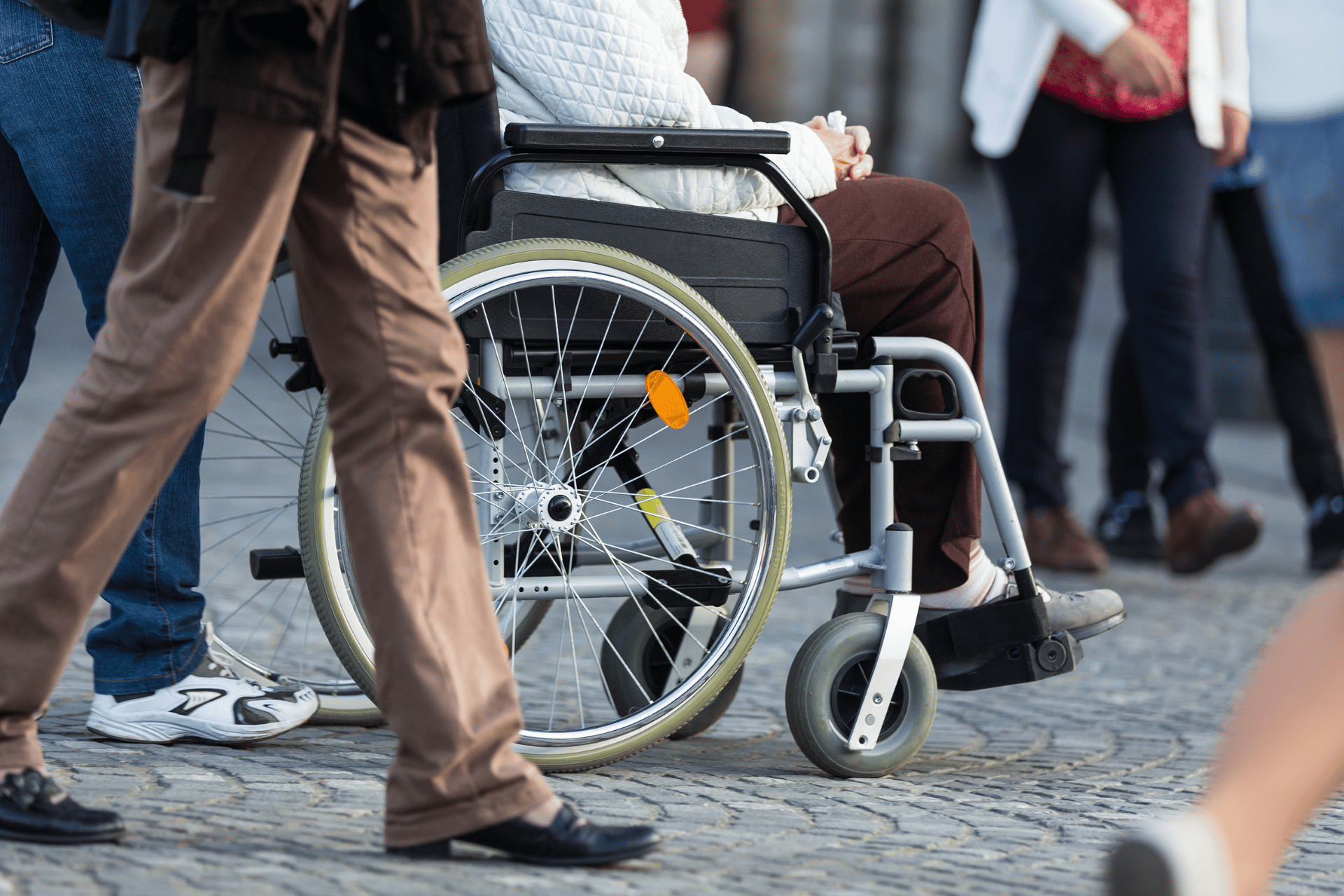 People walking with a wheelchair