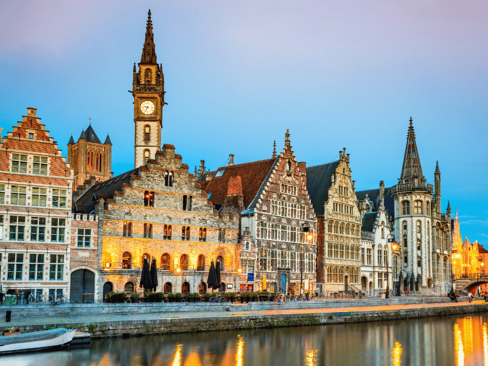 Clocktower and houses of Ghent. The canal is also showing. 