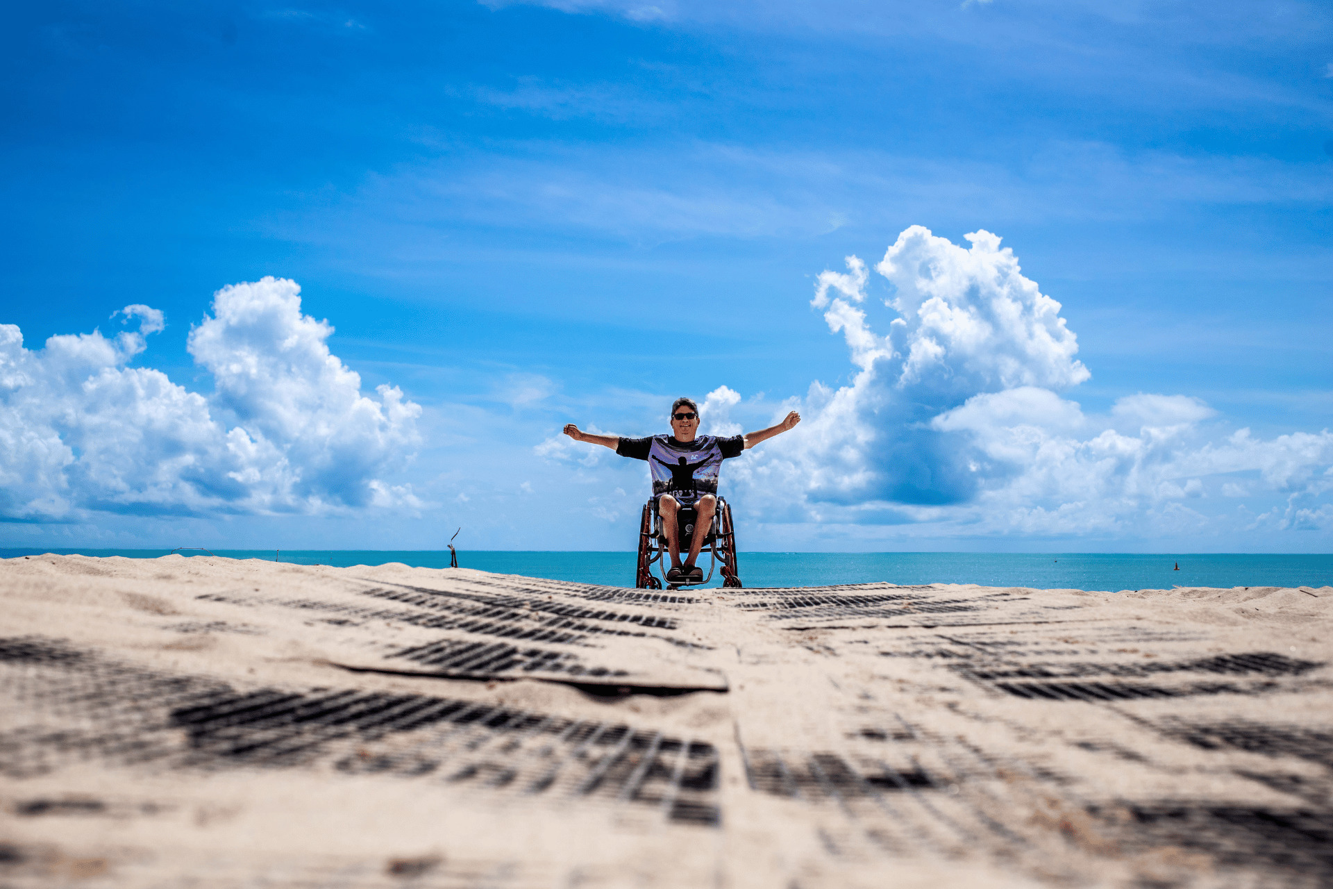 Wheelchair user on accessible East Coast beache