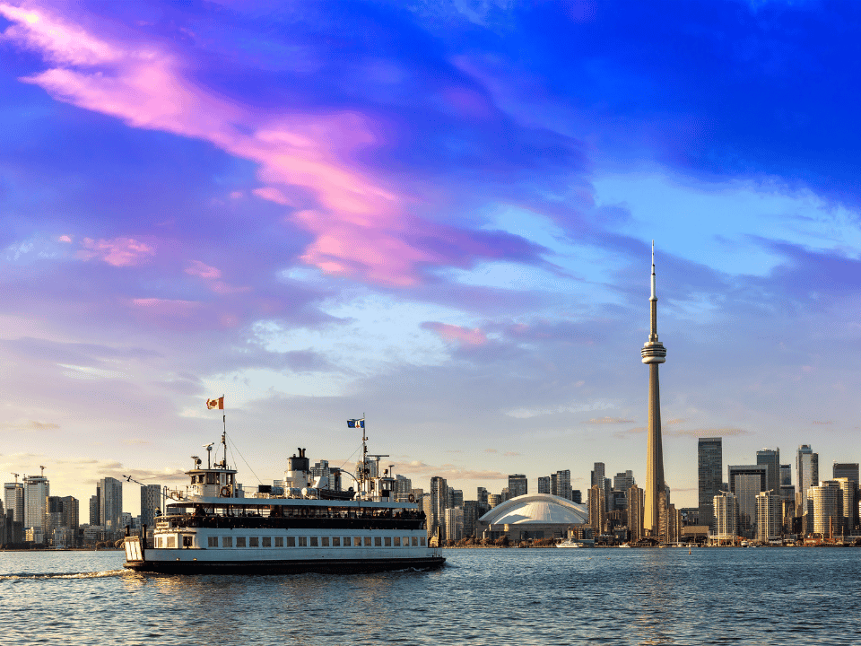 A boat tour with a view of the CN Tower in the background