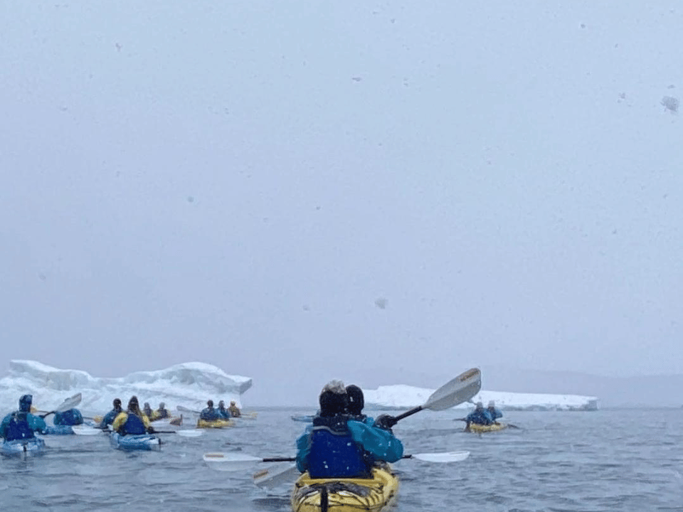 The whiteness of Antarctica. Renee and team in canoes. 