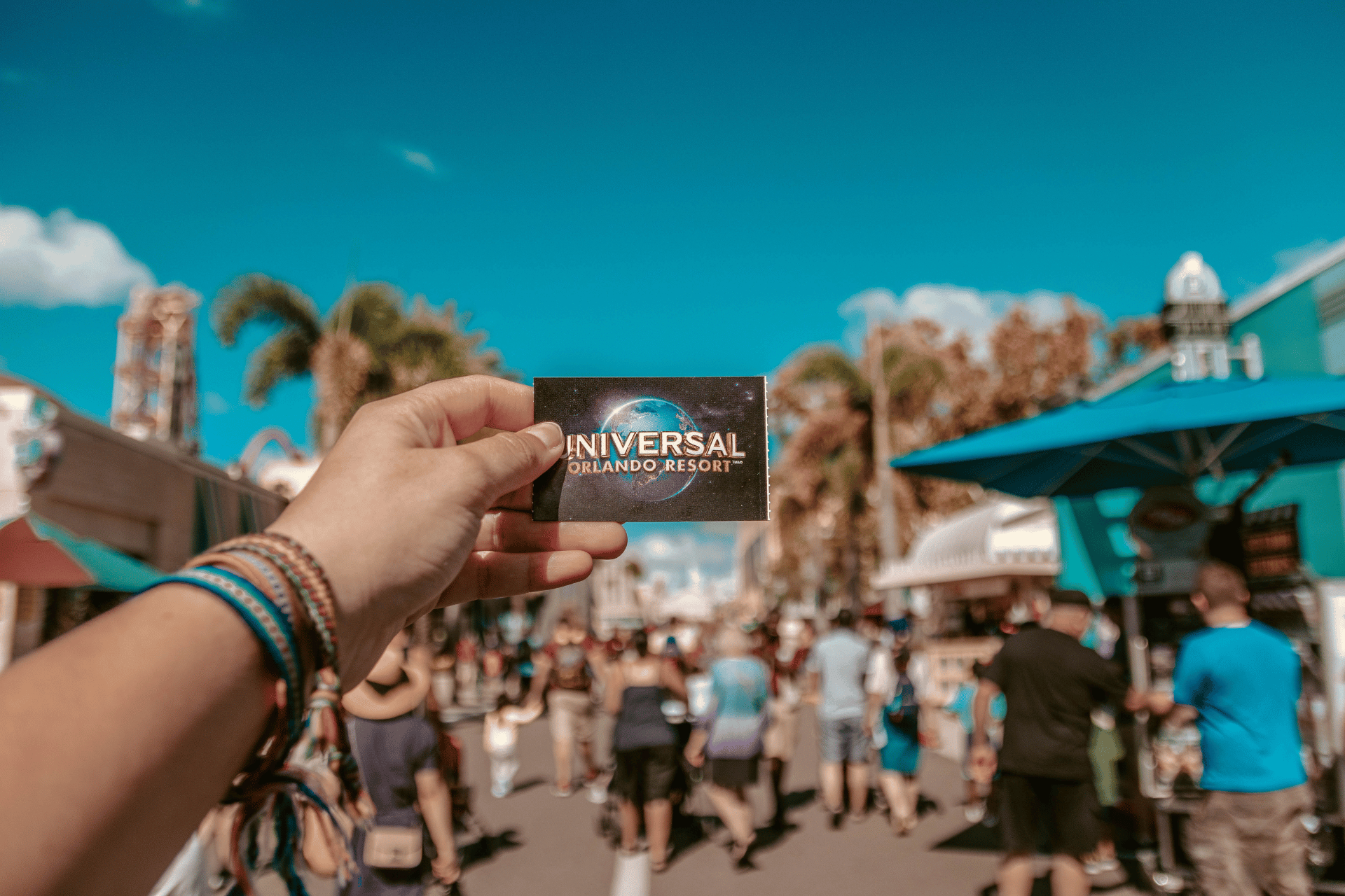 A visitor at Universal Orlando Resort showing their ticket.