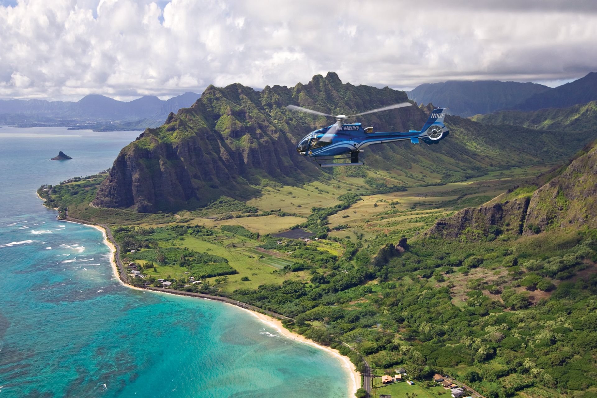 Blue Hawaii Helicopter ToursHelicopter in the foreground.
