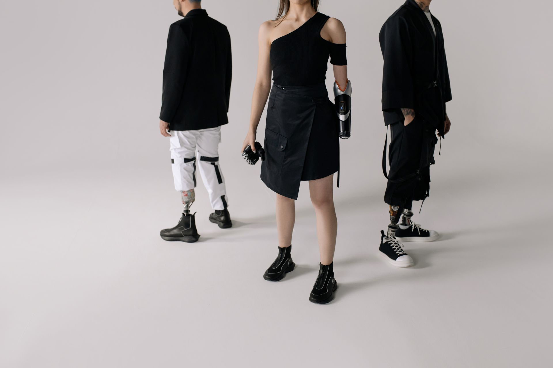 Men and Woman Wearing Prosthetic Legs and Arm