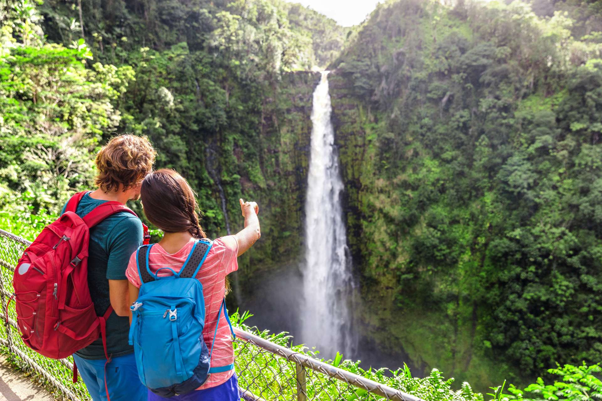 Hawaii Travel Tourists at Nature Waterfall Panoramic Landscape Banner. Travelers Couple Looking at