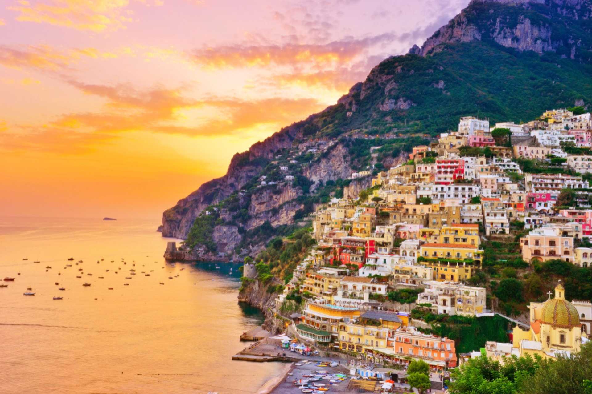 View of Positano village along Amalfi Coast in Italy at sunset. ©Shutterstock