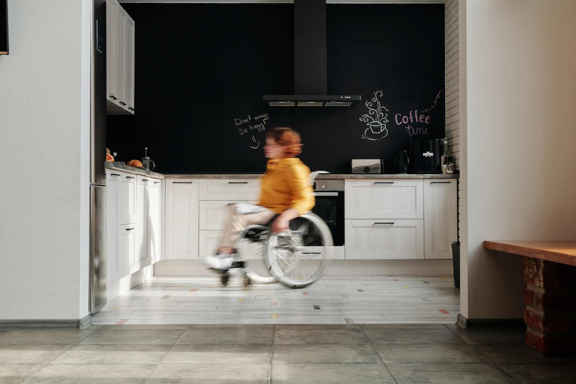 Woman on Wheelchair in a kitchen