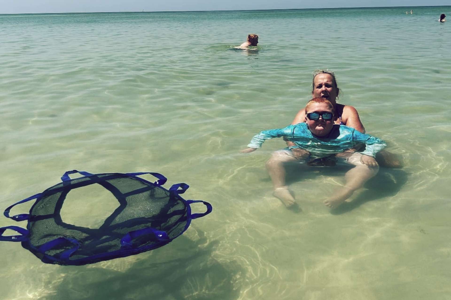 Dana and Tanner Edwards, in the sea with their Perfect Lift for Tanner to use
