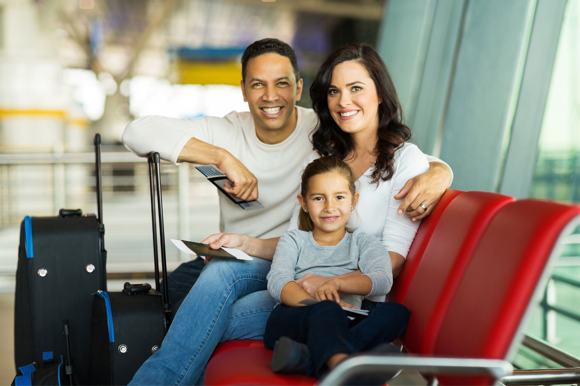 Happy family at airport waiting for flight