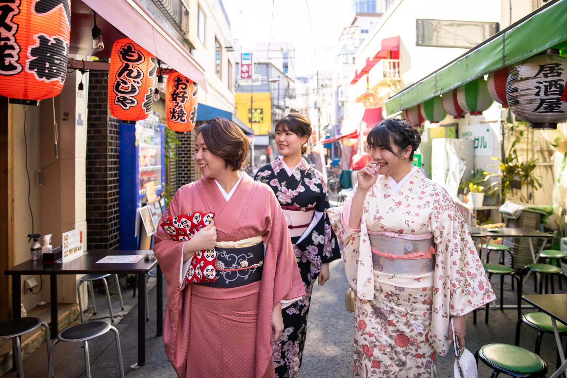 Japanese women in kimono walking in food markets in Kyoto