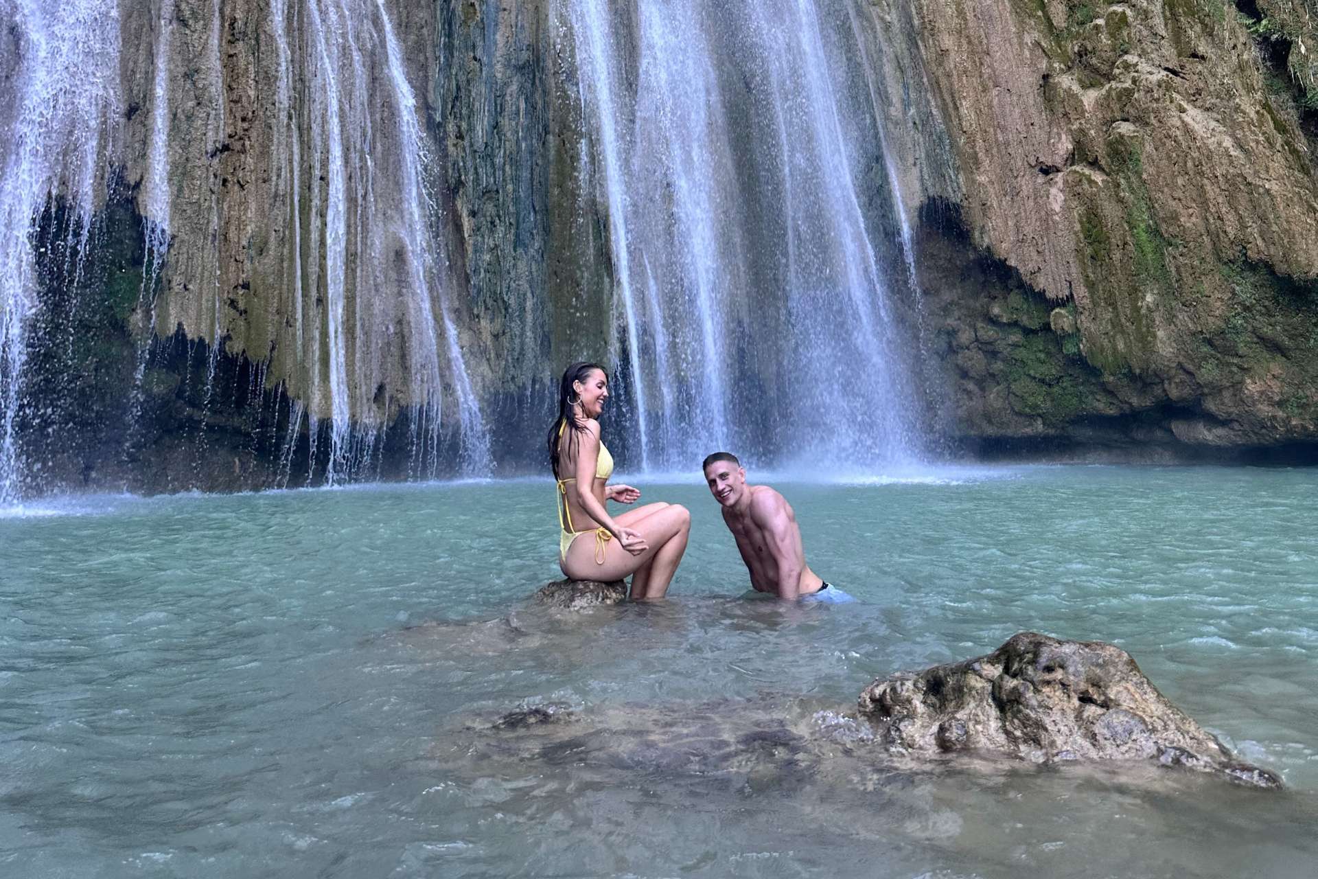 Marte and GK in the water of a waterfall in Dominican Republic